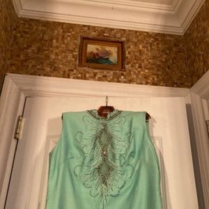 Beautiful light aqua-green dress with a jeweled collar